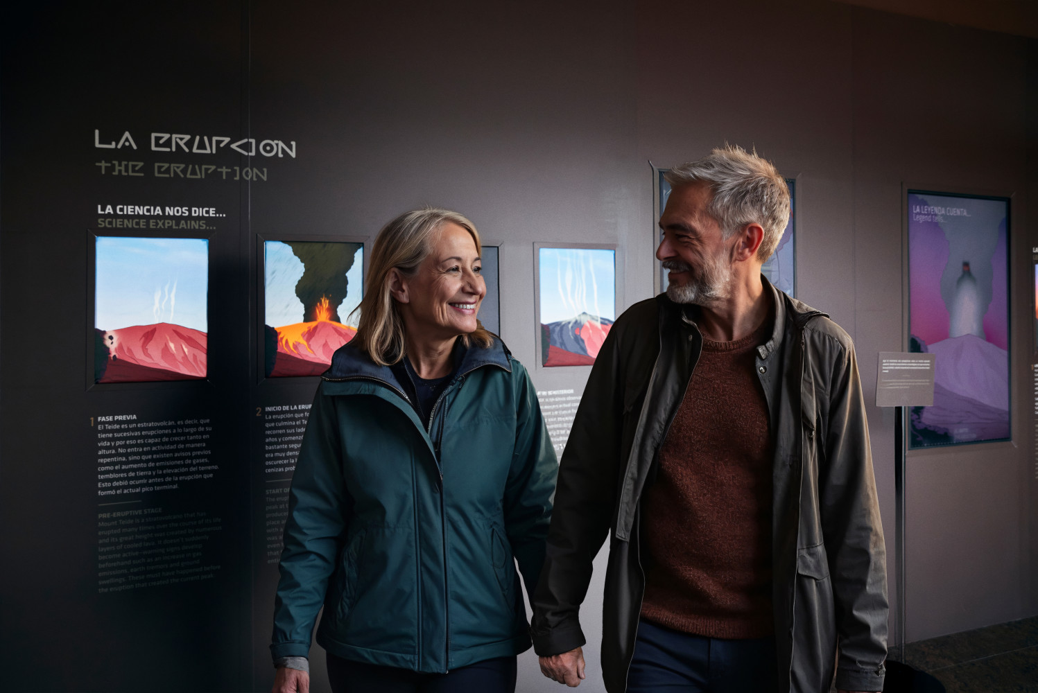 Couple reading an information panel at the Teide Legend exhibition